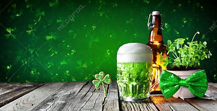 St Patrick`s Day - Green Beer In Glass With Bottle And Clovers