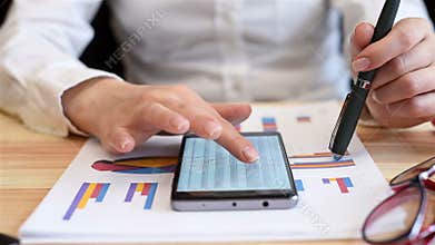 Woman Looking At Annual Sales Report