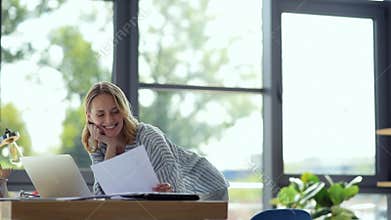 Pretty self employed lady having business call at home
