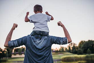 Dad with son playing baseball