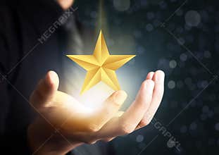Businessman holding excellence star