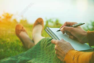 Girl with pen writing
