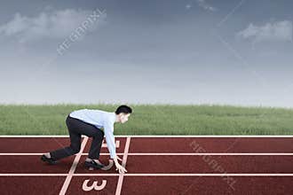 Businessperson ready to race and compete