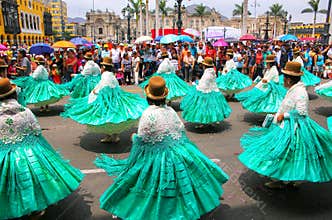 Local women dancing during Festival of the Virgin de la Candelaria in Lima, Peru.