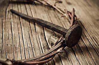 The crown of thorns of Jesus Christ and a nail on the Holy Cross