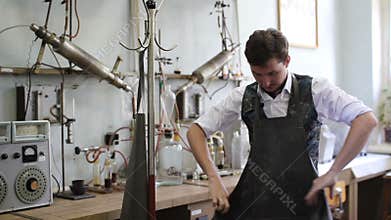 Man dress the lab coat before the chemical experiments