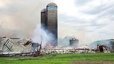 Firefighters battle silo fire.