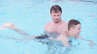 Happy family enjoying in pool