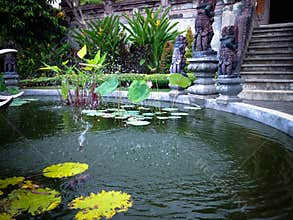 Peaceful Lotus Garden Pond Fountain In The Yard Of Buddhist Monastery In Bali