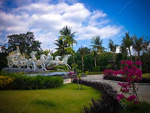 Beautiful Atmosphere Of Garden Park With Krishna`s Chariot Statue In The Sunny Windy Afternoon At Tangguwisia Village