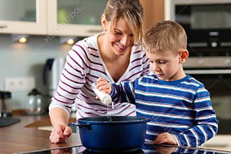 Family cooking in kitchen