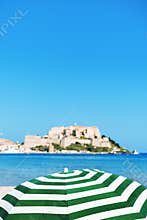 Beach umbrella in Calvi, Corsica, France