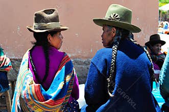 Talking women on sunday market in Pisac, Peru.