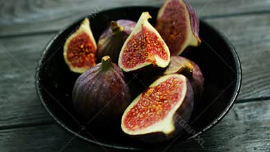 Bowl full of cut figs