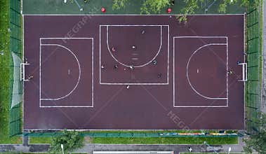 Small football field with asphalt in the Park view from drone