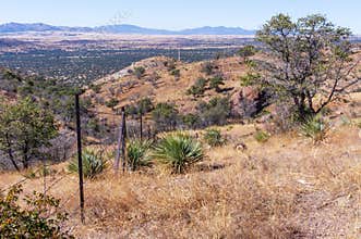 The US-Mexico border fence on Arizona mountains
