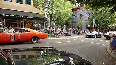 Saint Paul De Vence, France - 10 13 2018: Walking in front of a row of red vintage sports cars parked during a car show