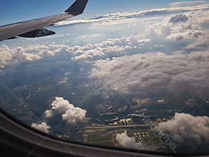 Plane taking off with cloudy sky
