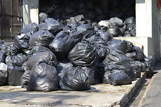 Black bags that put garbage inside and tie the bag stack in the garbage collection point.