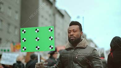 African american black activist look at camera. Blank afro banner. Copy space.