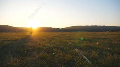 Motorcyclist riding to sunset on his motorbike. Man having active rest outdoor driving powerful motorcycle at sundown