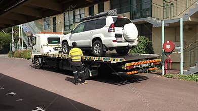 Car towing service truck towing a vehicle