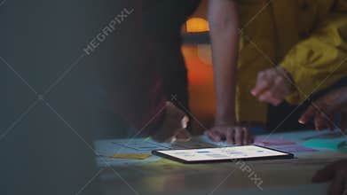 Group of Asia young creative people in smart casual wear discussing business brainstorming meeting ideas mobile application