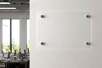 Blank horizontal transparent glass sign plate on the white wall in office.