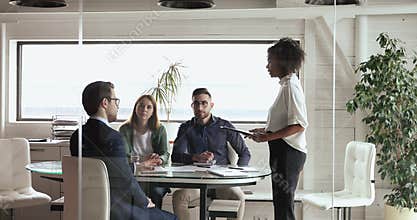 Multiethnic business team brainstorm on project at corporate meeting