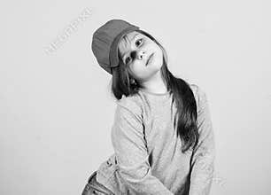 Little girl wearing bright baseball cap. Modern fashion. Kids fashion. Stylish accessory. Feeling confident with this