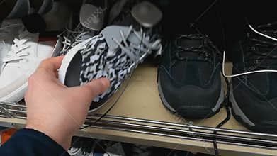 Male sneakers in store. Jogging shoes selection. Choose a pair of training shoes in shopping mall or hypermarket. Shelf