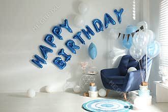 Phrase HAPPY BIRTHDAY made of balloon letters in decorated room