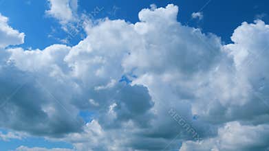 Spring Day With A Clear Blue Sky And Fluffy White Clouds. Day With Warm Sunshine Combined With Cool Breeze. Zoom Out.