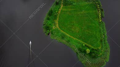 Flight over the peninsula. View of fields and meadows.