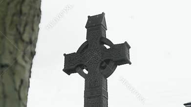 Slow-motion closeup of an old Irish Celtic cross in Athlone, Ireland