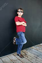 Casual boy leaning against wall