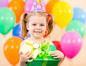 Pretty girl with colourful balloons and gift