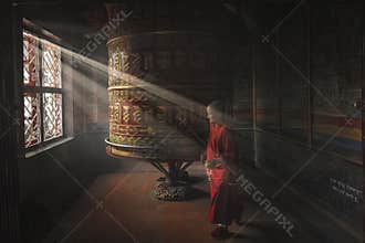 Elderly Buddhist nun during daily prayers at the mantra wheel at Boudhanath Monastery