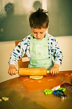 Small boy baking cookies
