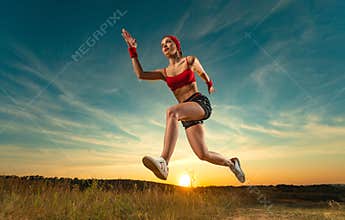 Runner concept. Woman athlete running on the trail. Fitness and sport motivation. Sprinter run. Download photo for