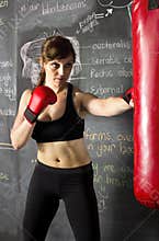 Female athlete hitting a punching bag