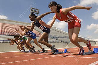 Women Taking Off From Starting Blocks