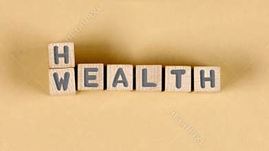Wooden blocks with wealth and health sign.