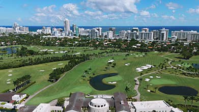 Areal view of wonderful fashionable resort next to multi-storey district with waterfront on background. Spectacular