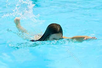 Girl learning to swim