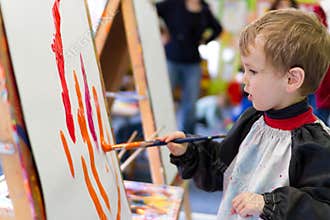 Kid painting at preschool