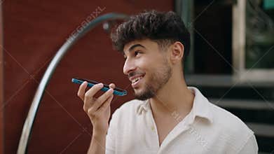Young arab man smiling confident talking on the smartphone at street