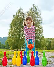 Little girl playing bowling