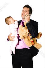 Businessman on phone with baby