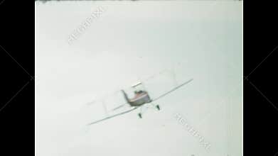 Biplanes performing stunts in a 1970s airshow
